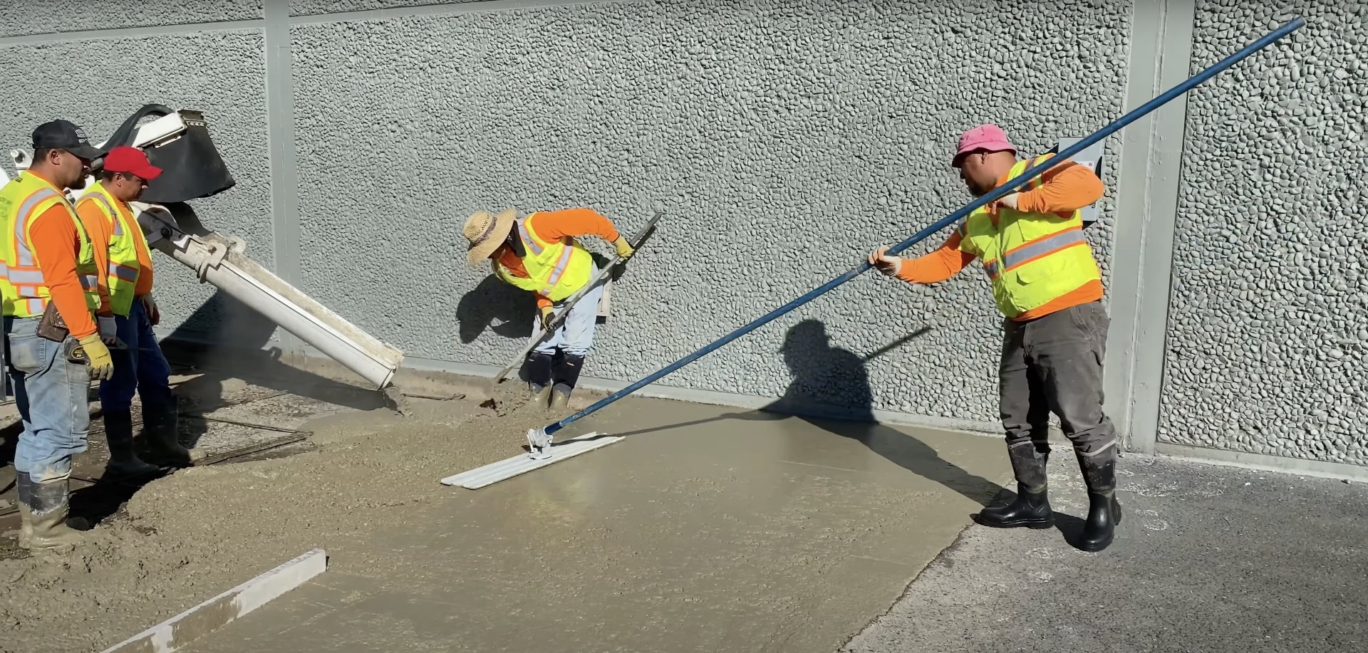 Professional concrete construction crew at work Commercial concrete construction team working with equipment