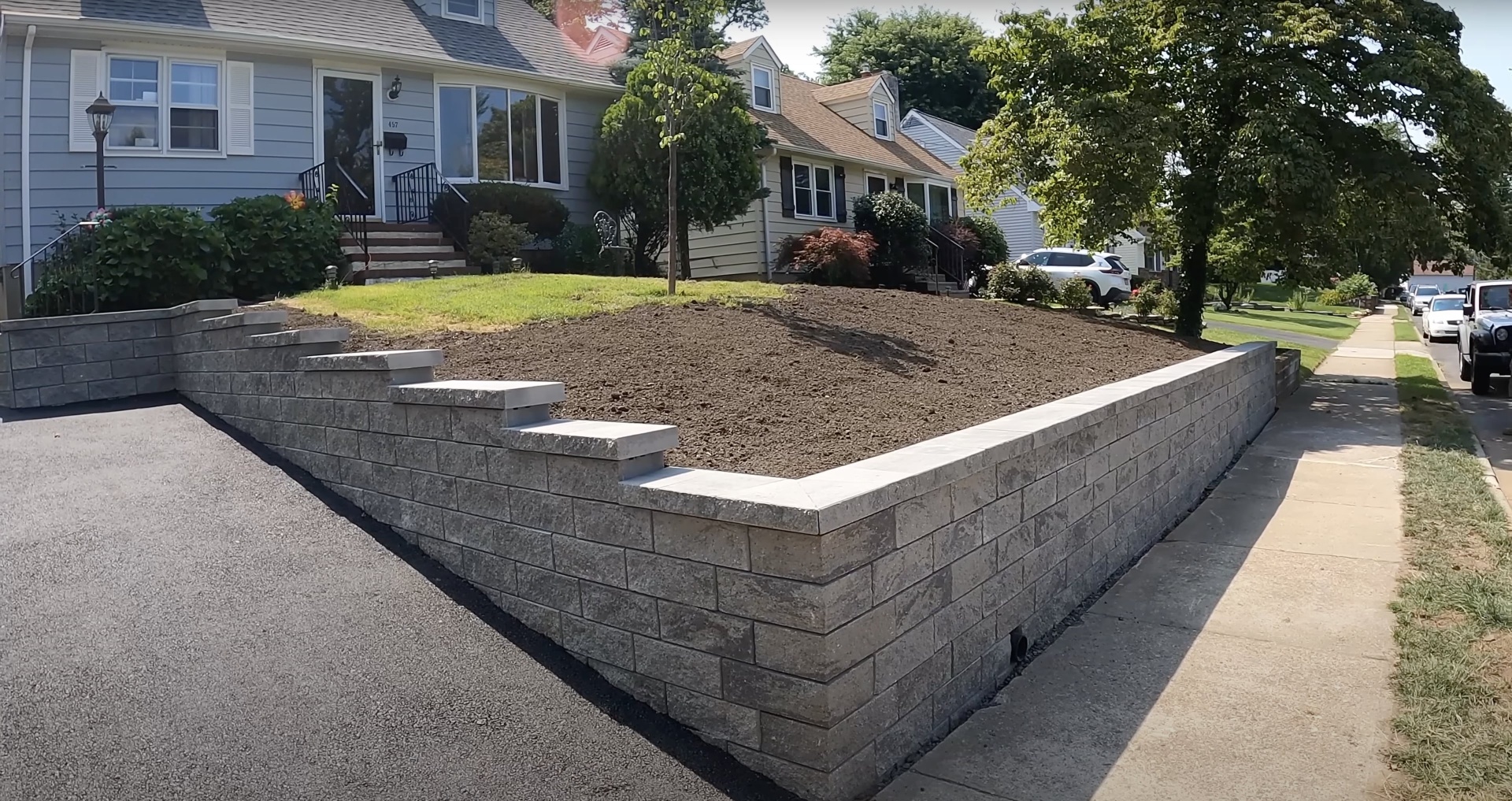 Completed concrete construction and landscape project Finished concrete retaining wall and landscaping project