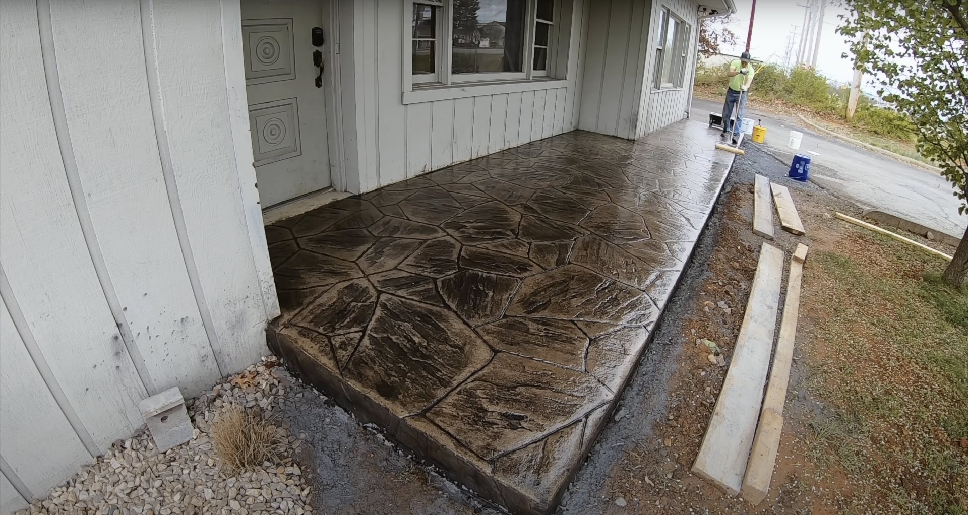 Beautiful stamped concrete patio installation Stamped concrete patio with decorative stone pattern design